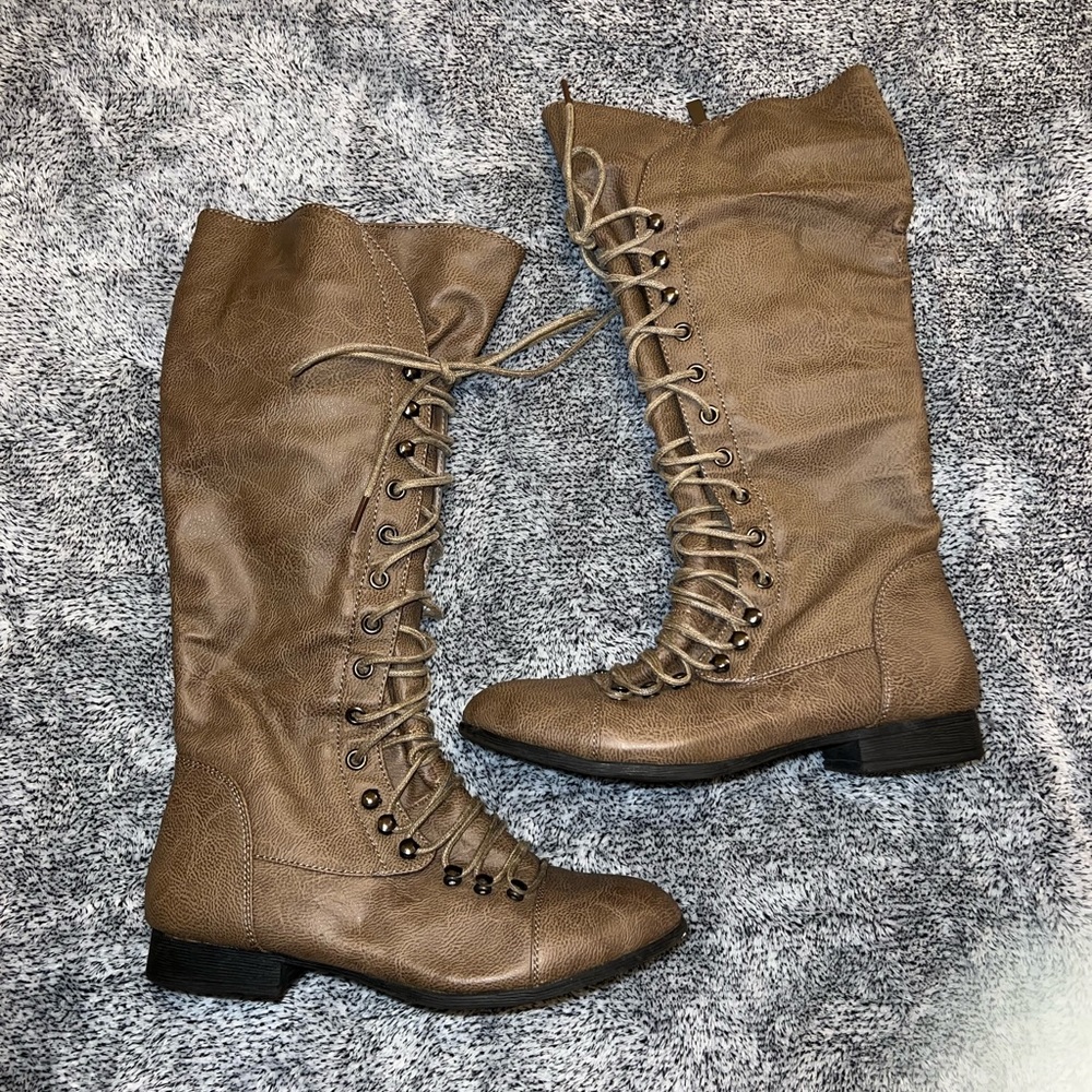 Lace up under the knee boots